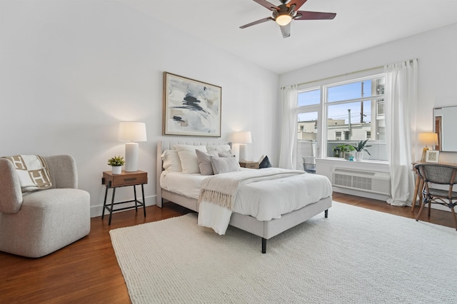 217 Newark Ave Unit 210, Jersey City, NJ 07302 - bedroom with dark wood-style flooring and a ceiling fan