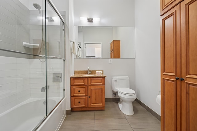 217 Newark Ave Unit 210, Jersey City, NJ 07302 - full bathroom with vanity, shower / bath combination with glass door, and tile patterned flooring