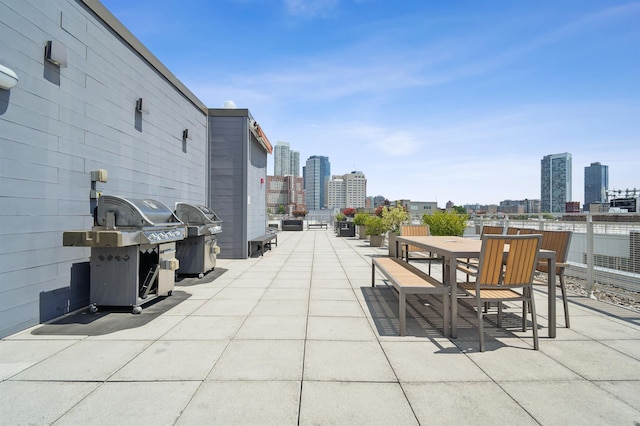 217 Newark Ave Unit 210, Jersey City, NJ 07302 - view of patio / terrace with a grill, a view of skyline, and outdoor dining space