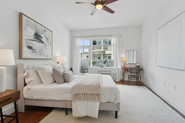 217 Newark Ave Unit 210, Jersey City, NJ 07302 - bedroom with wood finished floors, ceiling fan, and an AC wall unit