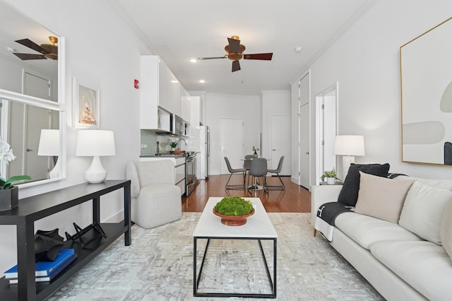 217 Newark Ave Unit 210, Jersey City, NJ 07302 - living area with a ceiling fan, ornamental molding, wood finished floors, and recessed lighting