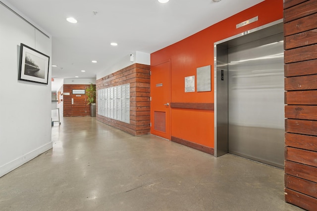 217 Newark Ave Unit 210, Jersey City, NJ 07302 - hallway with elevator, concrete flooring, and recessed lighting