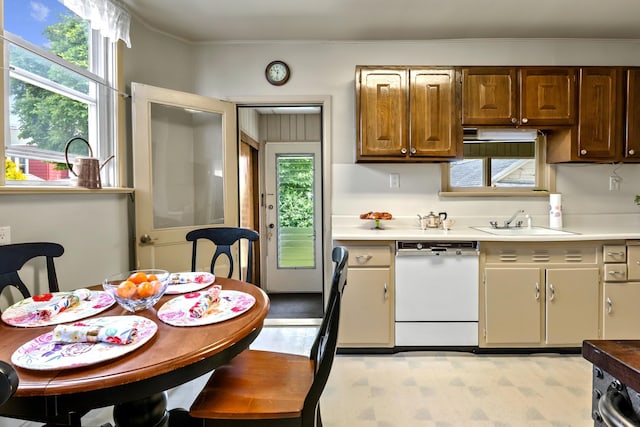 83 W 38th St, Bayonne, NJ 07002 - kitchen with white dishwasher, light countertops, and ornamental molding