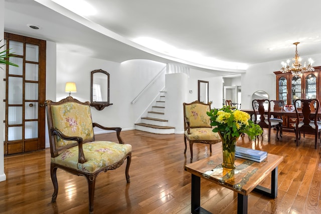 83 W 38th St, Bayonne, NJ 07002 - living room featuring stairway, a chandelier, and hardwood / wood-style flooring