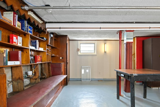 83 W 38th St, Bayonne, NJ 07002 - below grade area featuring baseboards and a textured ceiling