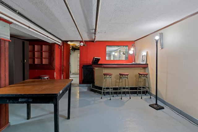 83 W 38th St, Bayonne, NJ 07002 - indoor dry bar with finished concrete flooring and a textured ceiling