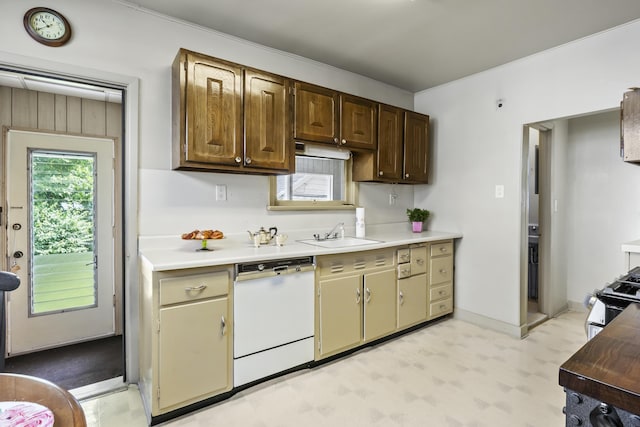 83 W 38th St, Bayonne, NJ 07002 - kitchen featuring dishwasher, light floors, light countertops, stainless steel range, and ornamental molding