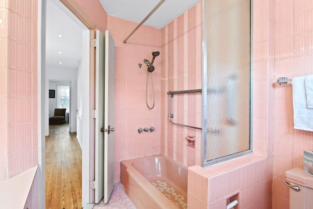 83 W 38th St, Bayonne, NJ 07002 - bathroom with bathing tub / shower combination and wood finished floors