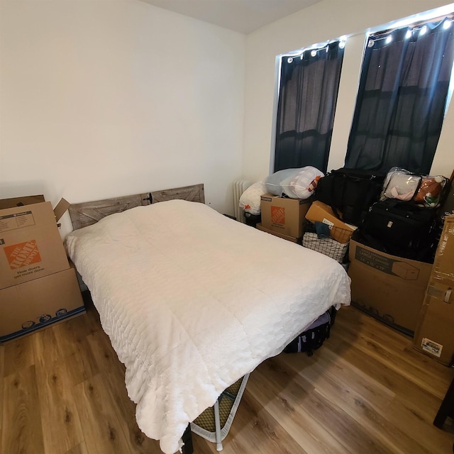 bedroom featuring wood finished floors