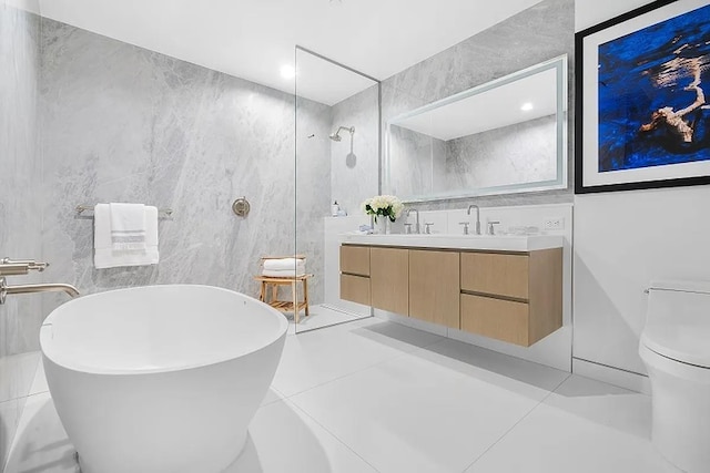 320 Adolphus Ave Unit 907, Cliffside Park, NJ 07010 - bathroom featuring double vanity, tile walls, a soaking tub, and a walk in shower