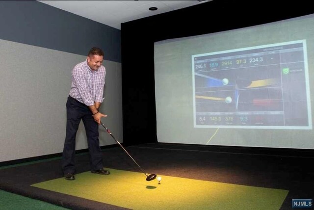 320 Adolphus Ave Unit 907, Cliffside Park, NJ 07010 - playroom featuring golf simulator and carpet