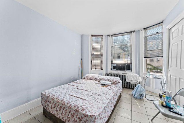 6113 Washington St, West New York, NJ 07093 - bedroom featuring radiator, multiple windows, and light tile patterned flooring