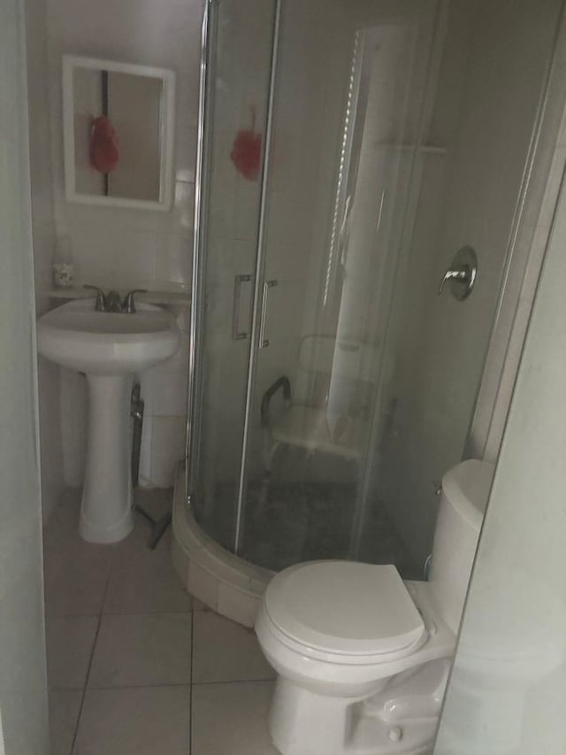 6113 Washington St, West New York, NJ 07093 - bathroom with a shower stall and tile patterned flooring