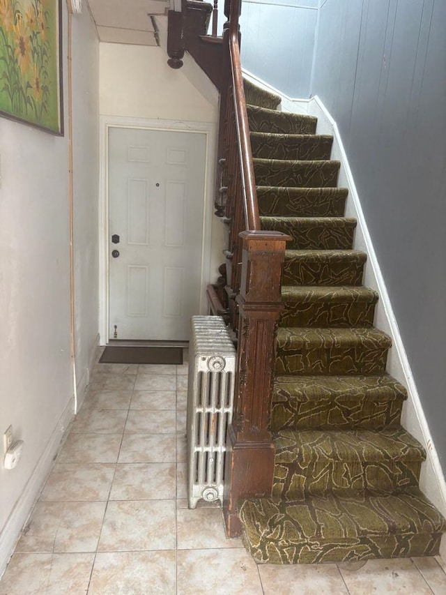6113 Washington St, West New York, NJ 07093 - staircase featuring tile patterned floors and radiator heating unit