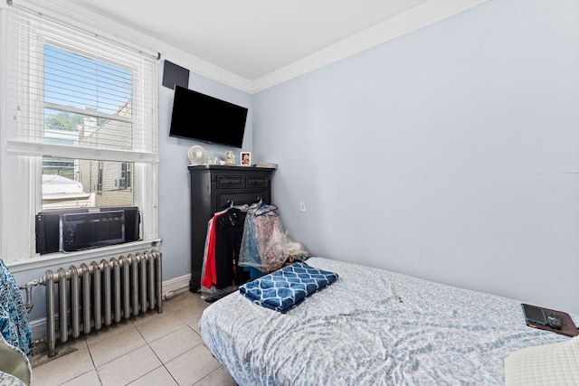 6113 Washington St, West New York, NJ 07093 - bedroom with radiator, tile patterned flooring, and crown molding