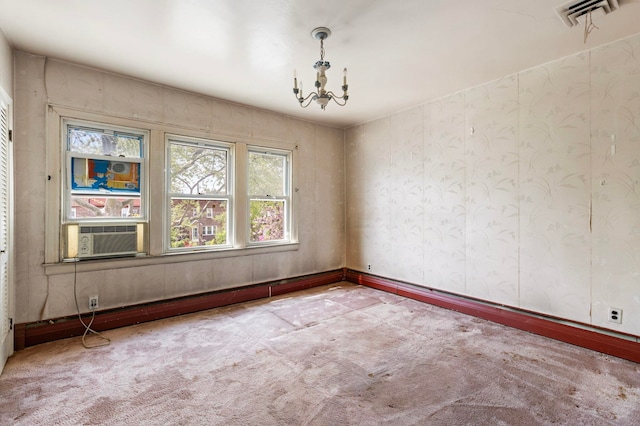6 Stegman Pl, Jersey City, NJ 07305 - spare room featuring carpet flooring, cooling unit, and a chandelier
