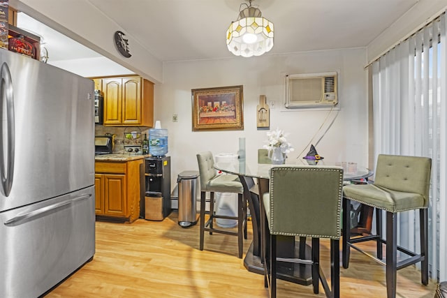 419 16th St, Union City, NJ 07038 - dining space with a wall mounted AC and light wood-type flooring
