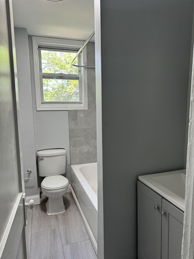 bathroom featuring toilet and vanity