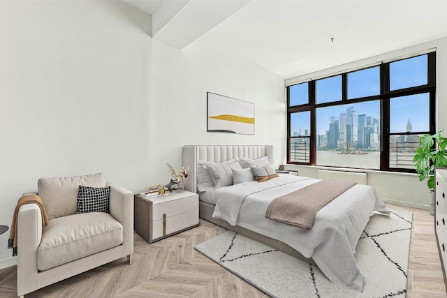 1500 Hudson St Unit 7H, Hoboken, NJ 07030 - bedroom featuring a skyline view and baseboards