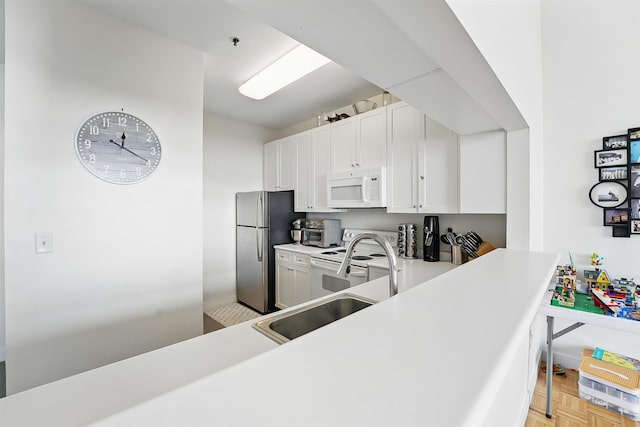 1500 Hudson St Unit 7H, Hoboken, NJ 07030 - kitchen with white appliances, light countertops, and white cabinetry