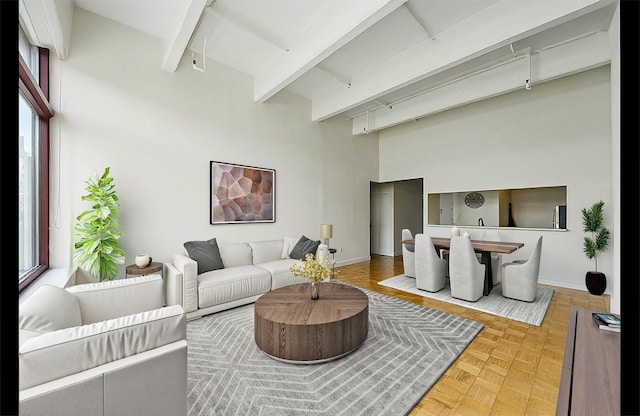 1500 Hudson St Unit 7H, Hoboken, NJ 07030 - living area with a towering ceiling, beam ceiling, and track lighting