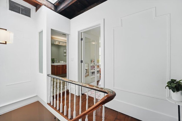 207 7th St, Hoboken, NJ 07030 - hallway with wood finished floors and an upstairs landing