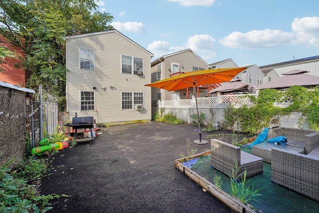 back of property with an outdoor hangout area