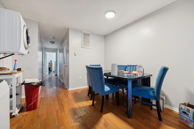 dining space with hardwood / wood-style flooring