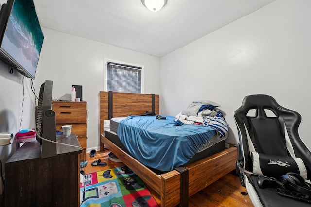 bedroom with hardwood / wood-style floors