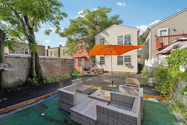 rear view of house with an outdoor hangout area