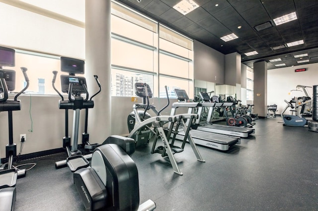 workout area with a high ceiling