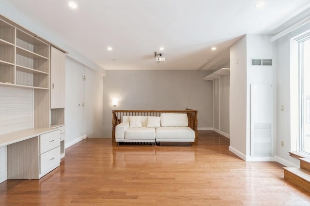 unfurnished living room with light hardwood / wood-style floors