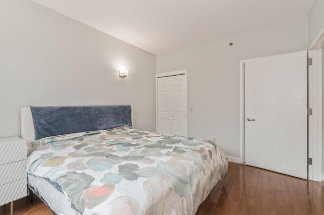 bedroom with hardwood / wood-style flooring