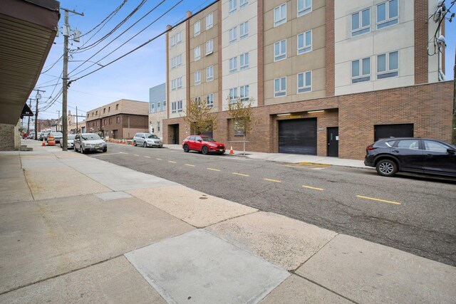 view of street with sidewalks and curbs