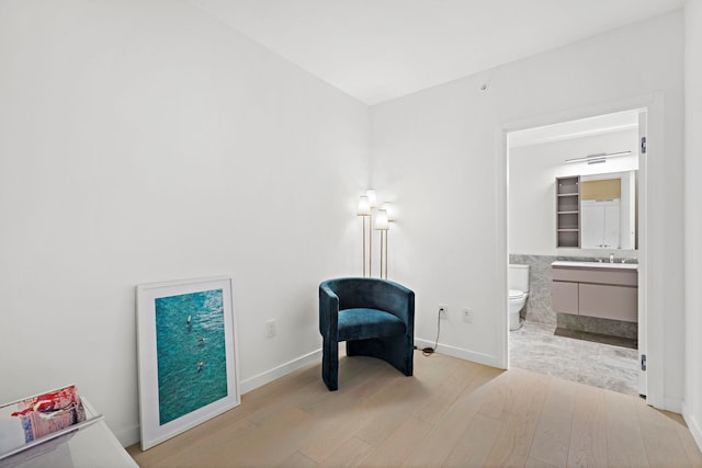 sitting room featuring light hardwood / wood-style floors