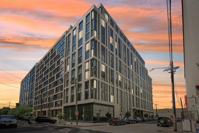 view of outdoor building at dusk