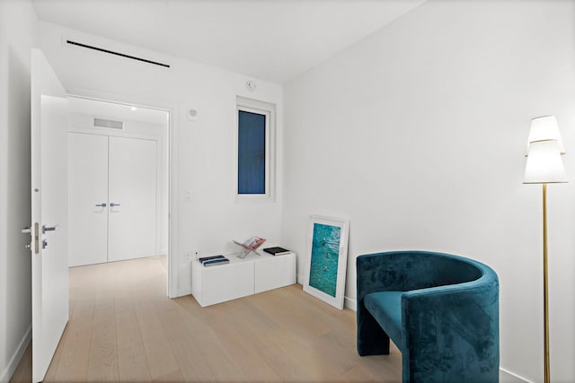 sitting room with light hardwood / wood-style floors