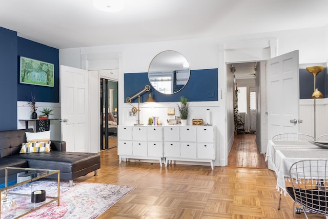 258 Montgomery St Unit 0, Jersey City, NJ 07302 - living area with a wainscoted wall and healthy amount of natural light