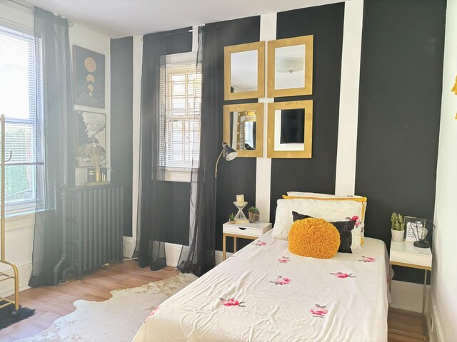 bedroom featuring wood finished floors