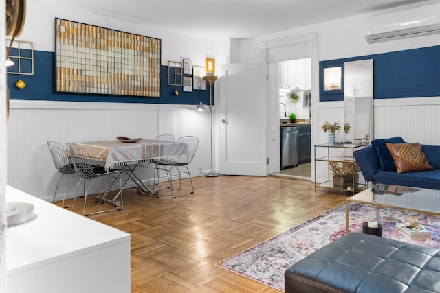 258 Montgomery St Unit 0, Jersey City, NJ 07302 - living area featuring a wall mounted AC and wainscoting