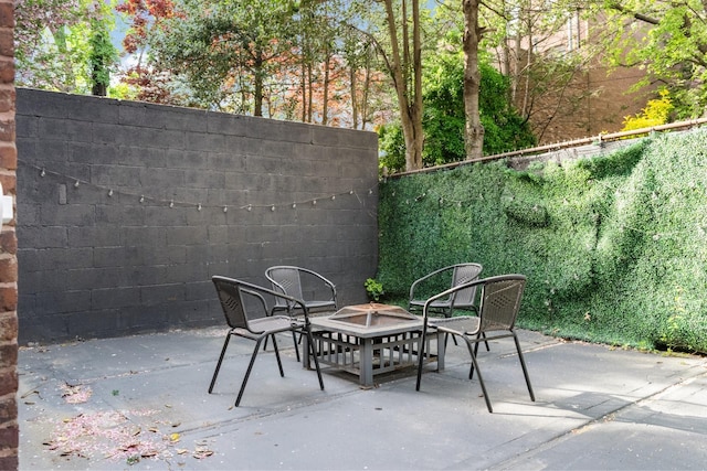 258 Montgomery St Unit 0, Jersey City, NJ 07302 - view of patio featuring a fire pit and fence