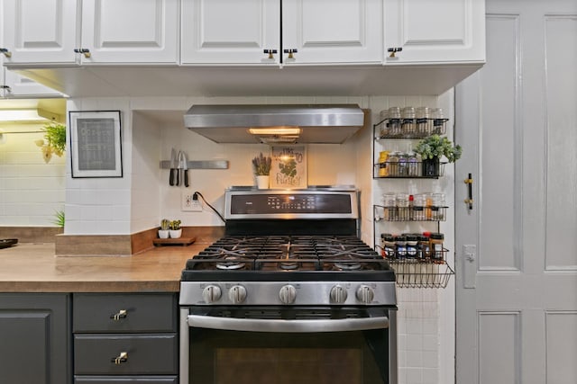 258 Montgomery St Unit 0, Jersey City, NJ 07302 - kitchen with stainless steel gas range oven, wall chimney exhaust hood, gray cabinets, and white cabinets