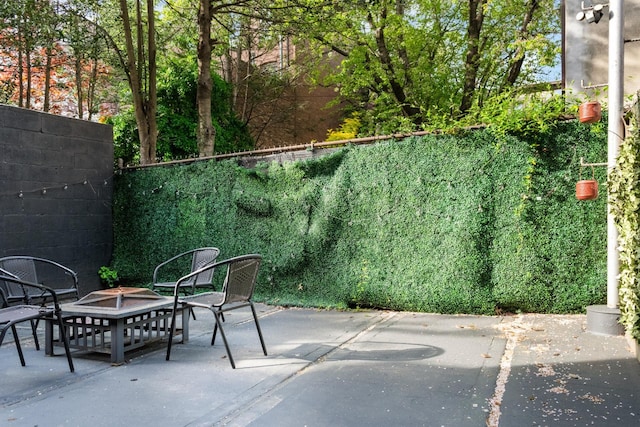 258 Montgomery St Unit 0, Jersey City, NJ 07302 - view of patio with an outdoor fire pit and fence