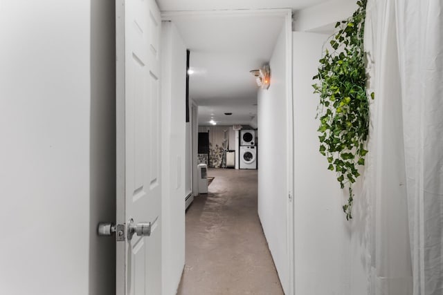 258 Montgomery St Unit 0, Jersey City, NJ 07302 - corridor featuring stacked washer / drying machine and concrete flooring