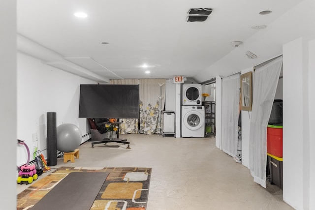 258 Montgomery St Unit 0, Jersey City, NJ 07302 - workout room with stacked washer and clothes dryer and a baseboard radiator