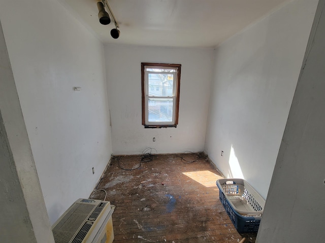 unfurnished room with wood-type flooring