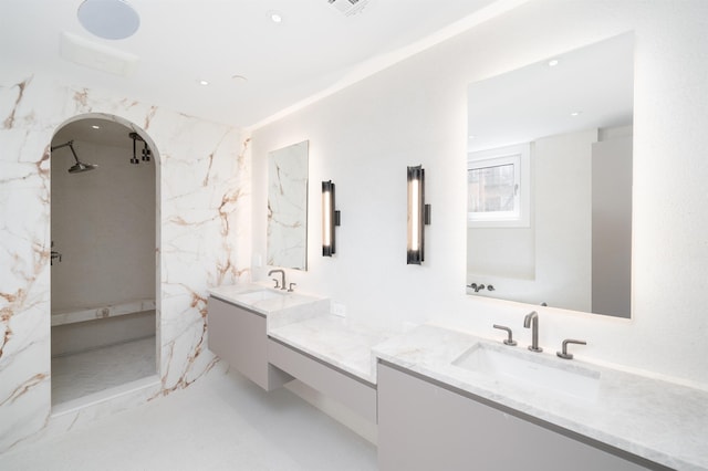 209 6th St Unit 1, Hoboken, NJ 07030 - bathroom featuring two vanities, a marble finish shower, and recessed lighting