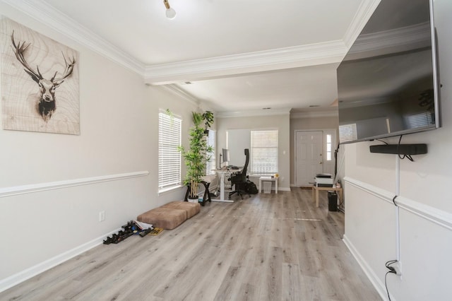 interior space with light hardwood / wood-style flooring and ornamental molding