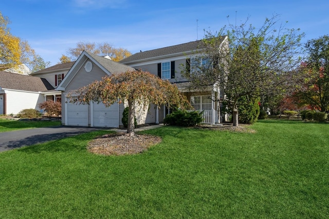 view of front of house with a garage and a front yard