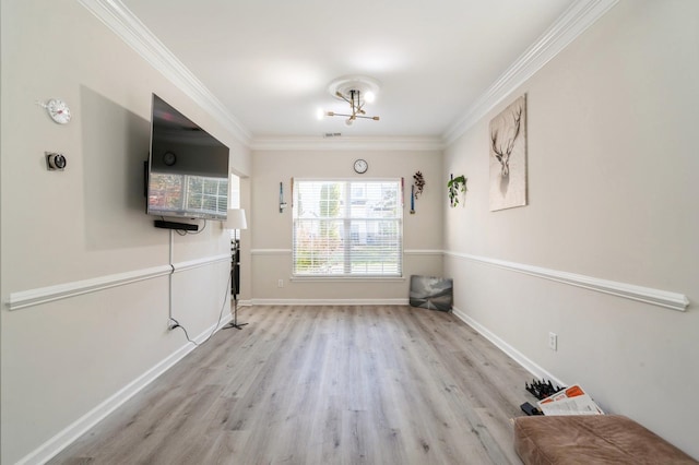 interior space featuring light wood-type flooring, a notable chandelier, and crown molding